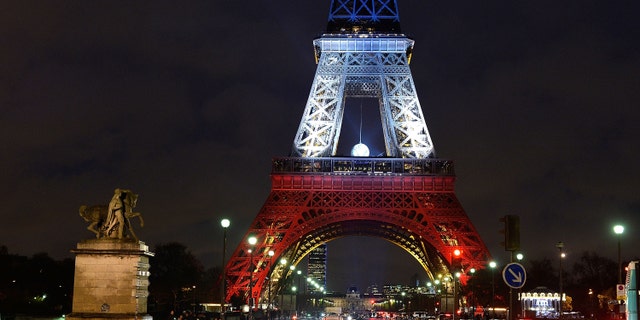 PARIS, FRANCE - NOVEMBER 20: The Eiffel Tower is illuminated in Red, White and Blue in honour of the victims of Friday's terrorist attacks on November 20, 2015 in Paris, France. Following the terrorist attacks in Paris last week, which claimed 130 lives and injured hundreds more, people continue to mark their solidariity for the victims. (Photo by Pascal Le Segretain/Getty Images)