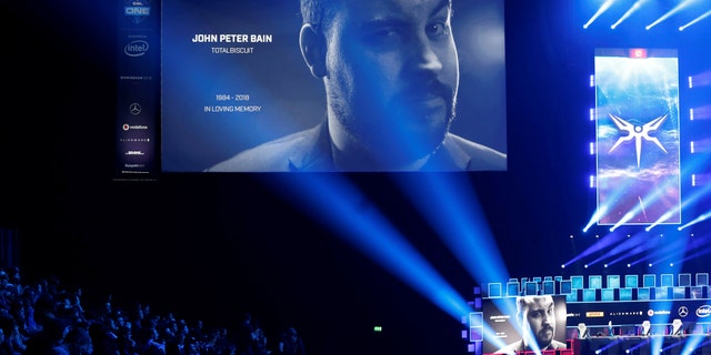 Esports - ESL One - Dota 2 Major - Arena Birmingham, Birmingham, Britain - May 26, 2018 Fans observe a minute's silence in memory of YouTube star John Peter Bain, also known as TotalBiscuit Action Images via Reuters/Ed Sykes - RC1B610D2F90