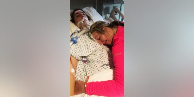 Cheryl Towery hugs her daughter, Elaina, who struggled with drug addiction for seven years.