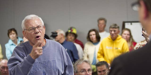 William Kouth of Omaha addresses Rep. Lee Terry R-Neb., during a town hall meeting held to discuss the Republican party's plan to privatize Medicare, in Omaha, Neb., Thursday, April 28, 2011. (AP Photo/Nati Harnik)