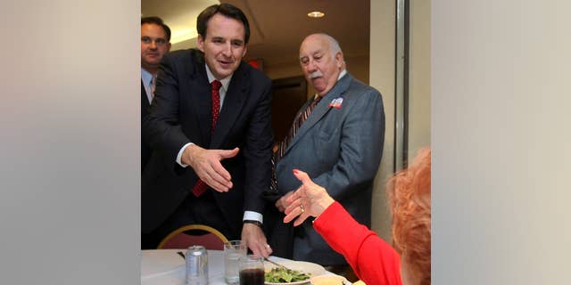 Minnesota Gov. Tim Pawlenty reaches to shake hands with Mary Smyk during a campaign luncheon for Republican congressional candidate Frank Guinta, back left, in Manchester, N.H., Thursday, Sept. 30,2010. Pawlenty is packing in three fund raisers for Republican candidates in New Hampshire. (AP Photo/Jim Cole)