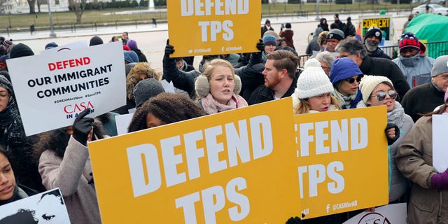 Demonstrators protest the Trump administration's decision to strip TPS for Salvadorans in the U.S.