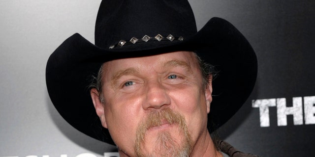 FILE - In this March 10, 2011 file photo, musician Trace Adkins arrives at the premiere of the feature film "The Lincoln Lawyer" in Los Angeles. Country music star Trace Adkins has lost his home to a fire.