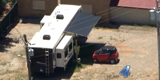 In this July 27, 2015, frame from video provided by KFOR-TV, a trailer sits on the grounds of the governor's mansion in Oklahoma City.