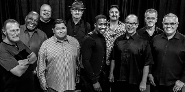 This Aug. 2016 photo provided by courtesy of Tower of Power/Webster Public Relations, shows the band members from Tower of Power, from left, Rocco Prestia, Roger Smith, Sal Cracchiolo, Adolfo Acosta, Stephen "Doc" Kupka, Marcus Scott, Tom E. Politzer, Emilio Castillo, David Garibaldi, and Jerry Cortez.