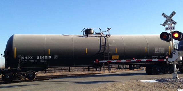 Nov. 14, 2014: A train loaded with oil tank cars idles on a track in North Dakota.