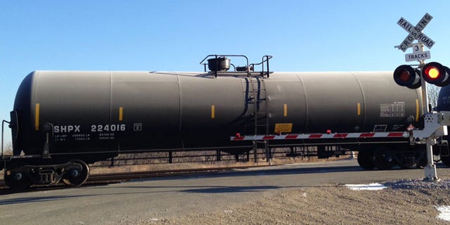 Nov. 14, 2014: A train loaded with oil tank cars idles on a track in North Dakota.