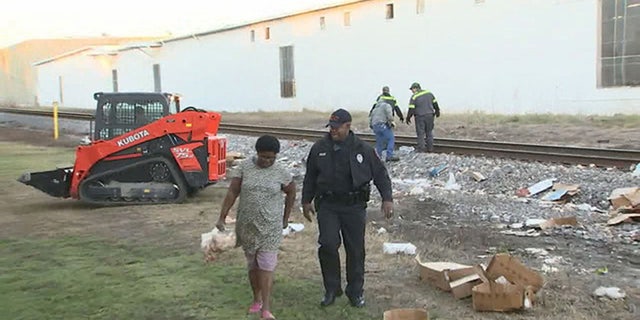 The authorities allowed people to collect the food for about an hour before they had to clear the site.