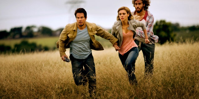 Mark Wahlberg, as Cade Yeager, Nicola Peltz as Tessa Yeager, and T.J. Miller as Lucas Flannery, in "Transformers: Age of Extinction."