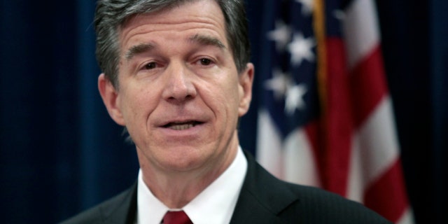 March 29, 2016: North Carolina Attorney General Roy Cooper speaks at a news conference in his state offices in Raleigh.