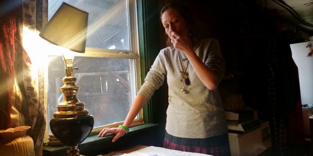 Michelle Knowles stands in her home Wednesday, Nov. 16, 2016, in North Vassalboro, Maine. Knowles is calling for more mental resources at juvenile detention facilities following her son Charles' suicide. Charles, a 16-year-old transgender boy who dreamed of being an LGBT activist, killed himself while temporarily detained at Long Creek Youth Development Center on Nov. 1, in South Portland, Maine. Family members say he was denied mental health care. (AP Photo/Marina Villeneuve)