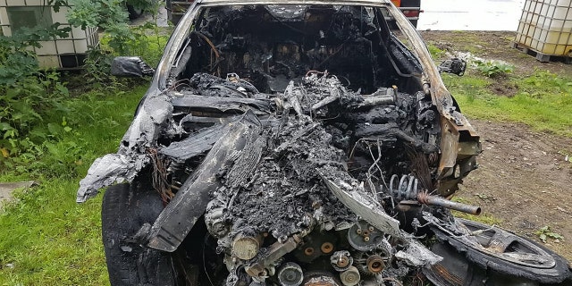 Damage to Andrew Lindsay's BMW after it burst into flames. A DAD-of-oneâs BMW 6 Series erupted in a fireball on a motorway and trapped him inside the burning car â when the locks jammed. See NTI story NTIBMW. Andrew Lindsay, 45, desperately tried to escape the motor when it burst into flames while he was travelling at 70mph on the M6 Toll Road. He managed to shoulder barge the driverâs door open and leap from the car moments before the engine exploded and melted the tyres to the road. Andrew, a copy editor from Whittington, Staffs., was on his way to see family in North Wales when the blaze broke out on June 1.