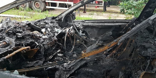 Damage to Andrew Lindsay's BMW after it burst into flames. A DAD-of-oneâs BMW 6 Series erupted in a fireball on a motorway and trapped him inside the burning car â when the locks jammed. See NTI story NTIBMW. Andrew Lindsay, 45, desperately tried to escape the motor when it burst into flames while he was travelling at 70mph on the M6 Toll Road. He managed to shoulder barge the driverâs door open and leap from the car moments before the engine exploded and melted the tyres to the road. Andrew, a copy editor from Whittington, Staffs., was on his way to see family in North Wales when the blaze broke out on June 1.