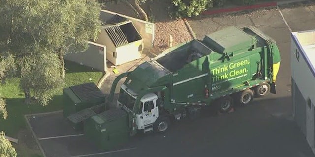 A truck driver told FOX10 he'd seen the man and woman living in the dumpster for six months.