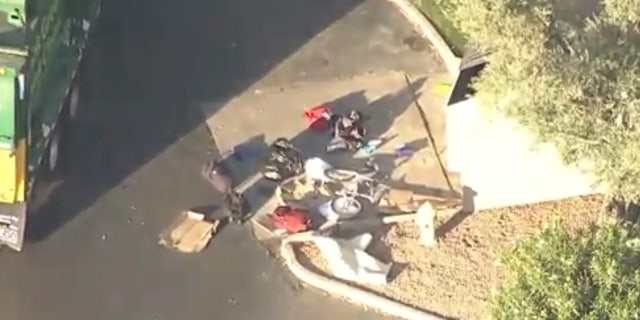 A homeless woman was critically injured after she was crushed in a garbage compactor.