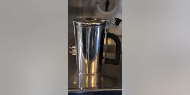 A hot cup sits on a counter inside a KC-10 Extender at Travis Air Force Base, Calif., in June.