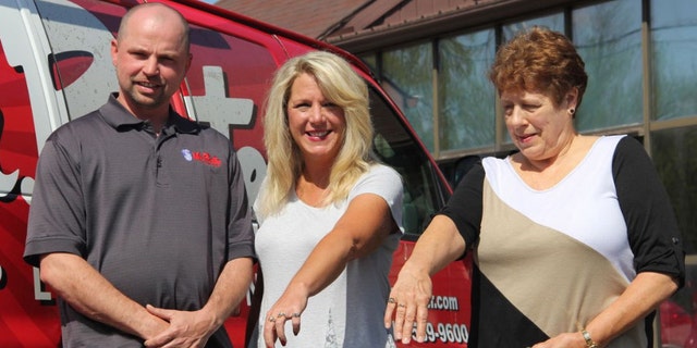 Trent Dawson, left, is pictured here with Cherie Kissiar, center, and Connie Keck, right, after giving them back their long-lost class rings.