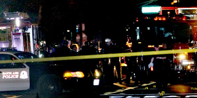 Oct. 31, 2014: Police and emergency respoders at the scene where three teenage girls trick-or-treating in costume were hit by a vehicle and killed while walking across a Southern California intersection in Santa Ana Calif.