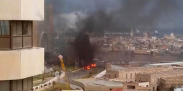 Jan. 27, 2015: In this image made from video posted by a Libyan blogger, the Cortinthia Hotel is seen under attack in Tripoli.
