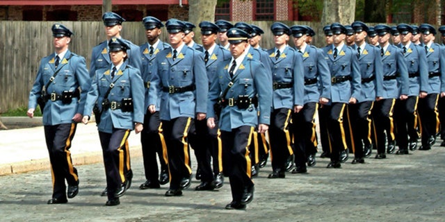 A new lawsuit alleges the State Police was pressured into accepting more racially diverse candidates for the police academy.