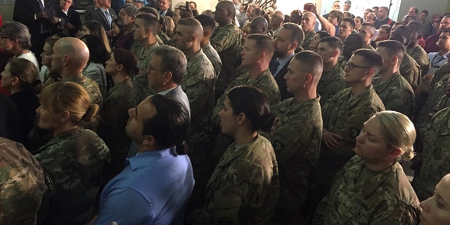 U.S. military members serving in Iraq listen as Vice President Joe Biden greets them, Thursday, April 28, 2016, at the U.S. Embassy in Baghdad. (AP Photo/Josh Lederman)