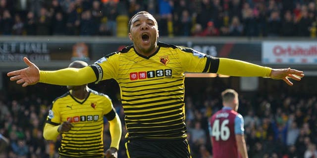 Watford's English striker Troy Deeney celebrates after scoring his second goal during the English Premier League football match between Watford and Aston Villa at Vicarage Road Stadium in Watford, north of London on April 30, 2016. / AFP / GLYN KIRK / RESTRICTED TO EDITORIAL USE. No use with unauthorized audio, video, data, fixture lists, club/league logos or 'live' services. Online in-match use limited to 75 images, no video emulation. No use in betting, games or single club/league/player publications. / (Photo credit should read GLYN KIRK/AFP/Getty Images)