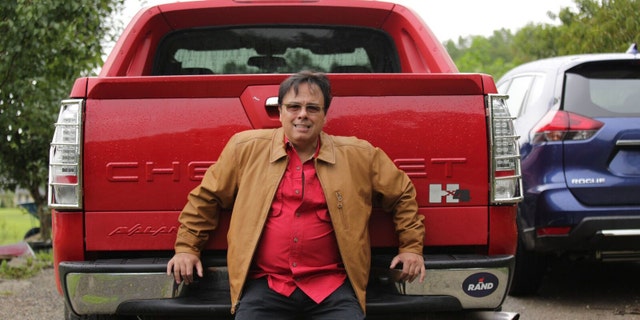 Gerardo Serrano with his new, leased truck. He is still making monthly payments of $673 on the seized truck as well as paying for its insurance and Kentucky license fees.