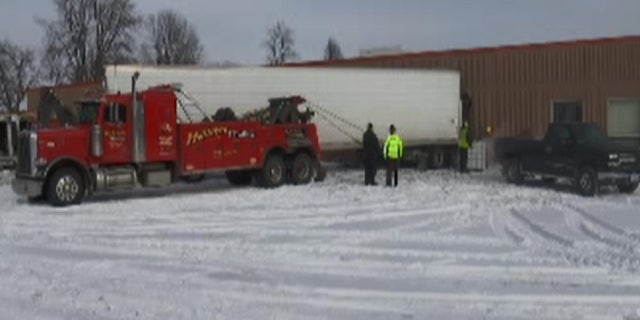 Two students were injured when a semi truck slammed into a school in Lyle, Minn.