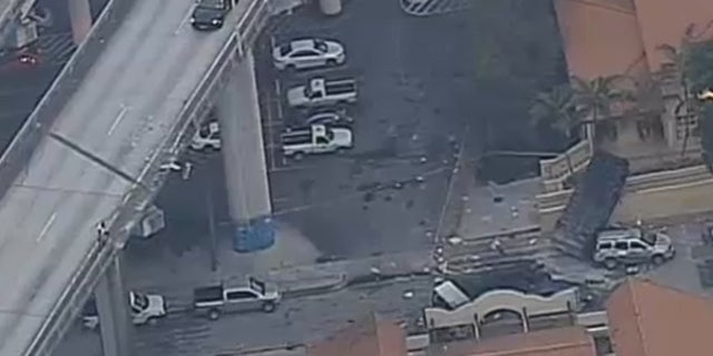 A garbage truck fell nearly 100 feet off Interstate 95 in Miami on Monday.