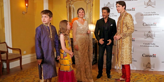 Trudeau, his wife Sophie Gregoire Trudeau, their daughter Ella Grace and son Xavier pose with Bollywood actor Shah Rukh Khan in Mumbai.