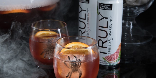 Truly Red Potion Punch with spiders and citrus.