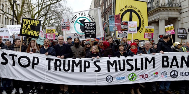 Demonstrators march in London to protest President Trump's travel ban.