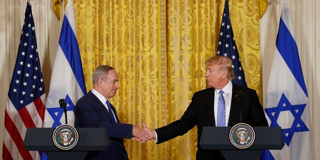 U.S. President Donald Trump greets Israeli Prime Minister Benjamin Netanyahu after a joint news conference at the White House. The two men are set to meet next week in Israel during Trump's first foreign trip as president.