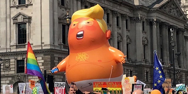 A balloon of 'baby Trump' floats on London's streets in protest of the U.S. president's visit.