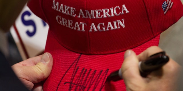 HARTFORD, CT - APRIL 15: Republican presidential candidate Donald Trump signs a hat after speaking at a rally at the Connecticut Convention Center on April 15, 2016 in Hartford, Connecticut. The 2016 Connecticut Republican Primary is scheduled for April 26, 2016. (Photo by Matthew Cavanaugh/Getty Images)