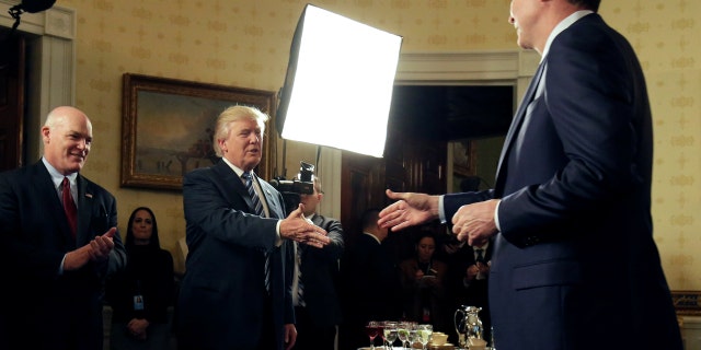 President Trump greets then-FBI Director James Comey at the White House on January 22, 2017.