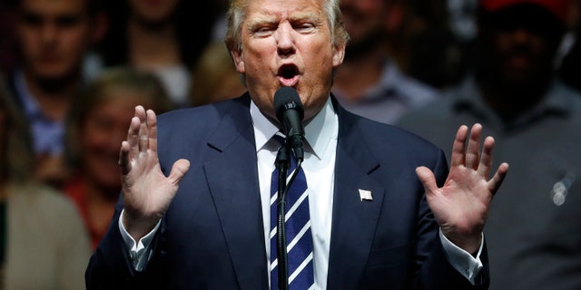 In this Dec. 9, 2016, photo, President-elect Donald Trump speaks to supporters during a rally, in Grand Rapids, Mich. In claiming that he scored âa massive landslide victoryâ in last monthâs presidential election, Trump turned history upside down. In fact, his winning margin in the Electoral College is on the other end of the historical spectrum, far closer to the narrowest win in history than to the widest. (AP Photo/Paul Sancya)