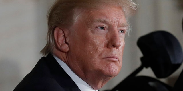 U.S. President Donald Trump attends a Congressional Gold Medal ceremony honoring former Senate majority leader Bob Dole (R) at the U.S. Capitol in Washington, U.S., January 17, 2018. REUTERS/Carlos Barria - HP1EE1H1LVVNC
