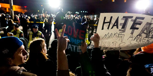 People protesting against Donald Trump in Bethpage, New York, Wednesday, April 6, 2016.