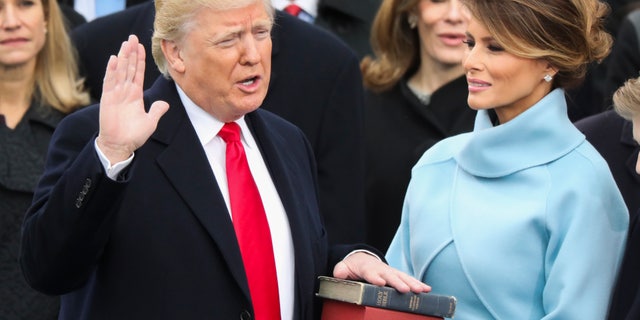 Donald Trump is sworn in as the 45th president of the United States as Melania Trump looks on during the 58th Presidential Inauguration at the U.S. Capitol in Washington, Friday, Jan. 20, 2017. (AP Photo/Andrew Harnik)