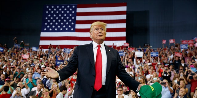 President Donald Trump arrives to speak to a campaign rally at the Ford Center, Thursday, Aug. 30, 2018, in Evansville, Ind. 