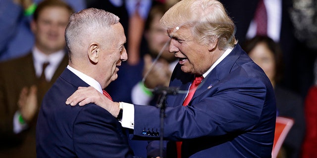 In this Dec. 6, 2016, photo, President-elect Donald Trump introduces retired Marine Corps Gen. James Mattis as his nominee for Secretary of Defense while speaking to supporters during a rally in Fayetteville, N.C.