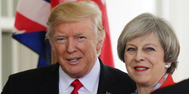 Jan. 27, 2017: U.S. President Donald Trump greets British Prime MinisterTheresa May as she arrives at the White House in Washington.