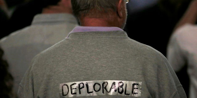 A supporter of President-elect Donald Trump wears tape with the word "deplorable" written on it in the audience at a campaign rally in Laconia, New Hampshire, U.S., September 15, 2016.