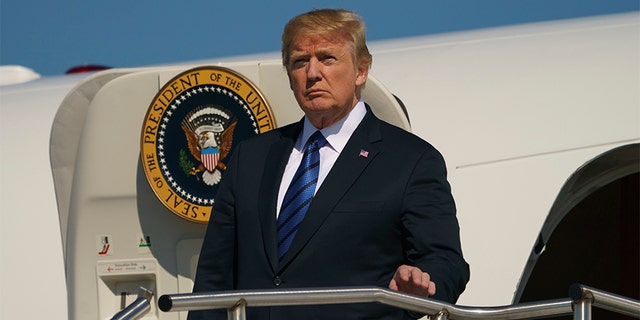 President Donald Trump arrives on Air Force One at Morristown Municipal Airport, in Morristown, N.J., Friday, July 20, 2018, en route to Trump National Golf Club in Bedminster, N.J.. (AP Photo/Carolyn Kaster)