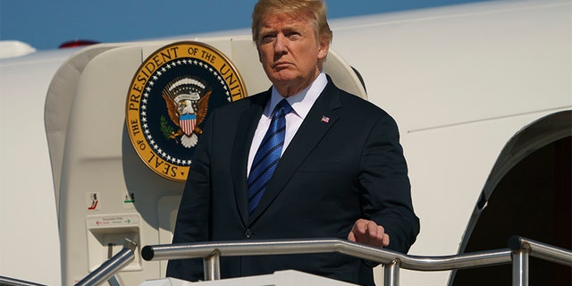President Donald Trump arrives on Air Force One at Morristown Municipal Airport, in Morristown, N.J., Friday, July 20, 2018, en route to Trump National Golf Club in Bedminster, N.J.. (AP Photo/Carolyn Kaster)