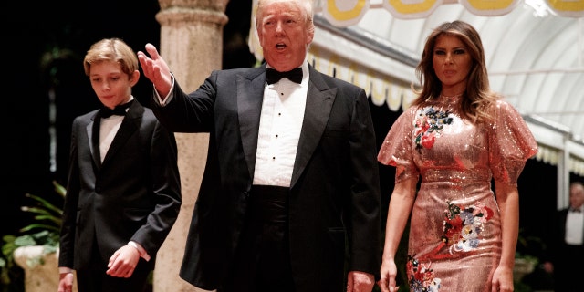 President Donald Trump, first lady Melania Trump and their son Barron arrive for a New Year's Eve party at Mar-a-Lago in Florida, Dec. 31, 2017.
