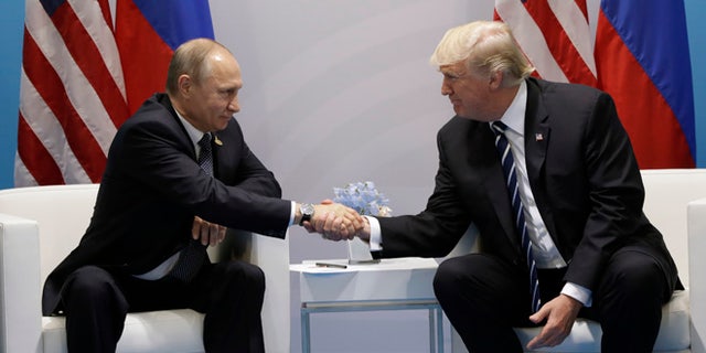 President Donald Trump shakes hands with Russian President Vladimir Putin at the G20 Summit, Friday, July 7, 2017, in Hamburg. (AP Photo/Evan Vucci)