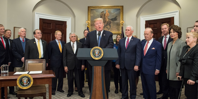 President Donald Trump speaks before signing the Presidential Space Directive - 1, directing NASA to return to the moon, in the Roosevelt room of the White House on Dec. 11, 2017.