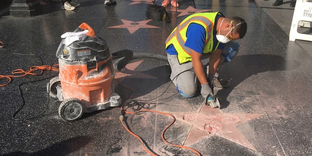A repair worker tends to Donald Trump's destroyed star on the Hollywood Walk of Fame. (Fox News/ Blanche Johnson)